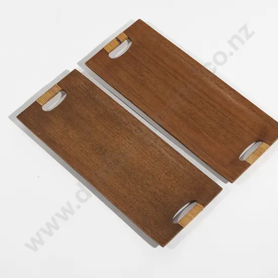 A Set Of Four Danish Teak Trays