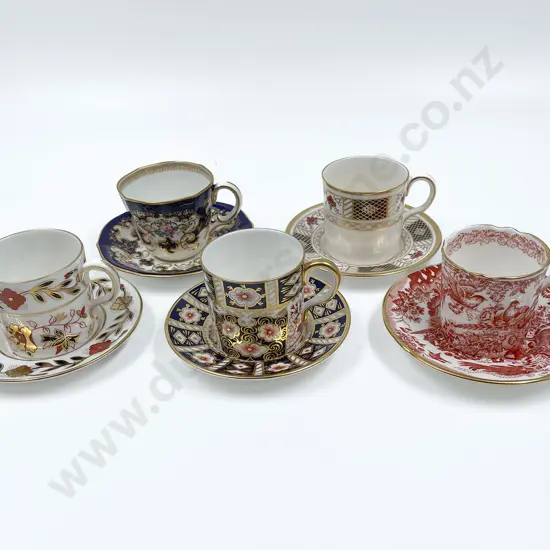 Nine RCD Demi Tasse Cups & Saucers with Two Ceramic Candlesticks & Brooch
