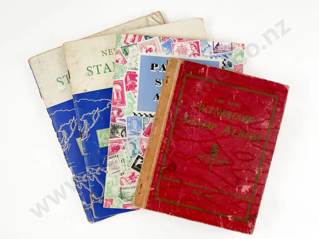 Four Vintage World Stamp Albums Image 1++