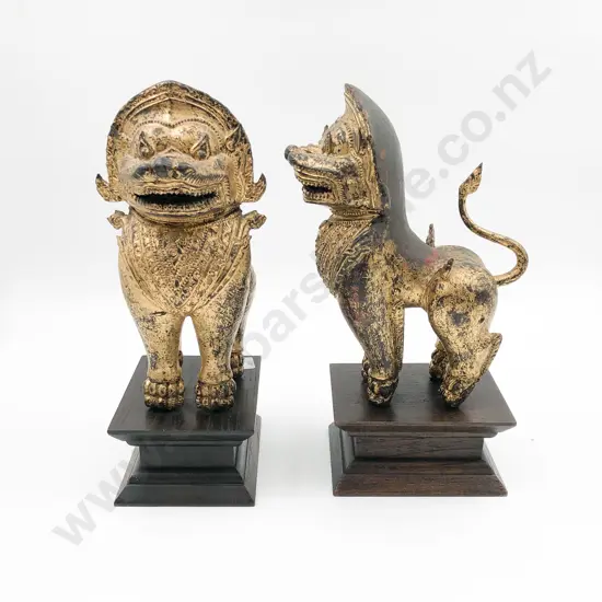 Pair of Gilt Painted Wrought Metal Temple Dogs on Stands