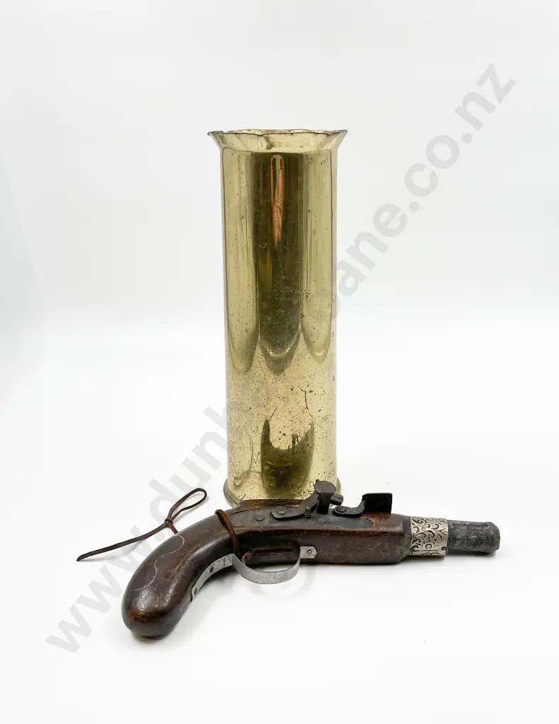 Brass Artillery Shell Together with Toy Pistol Image 1++