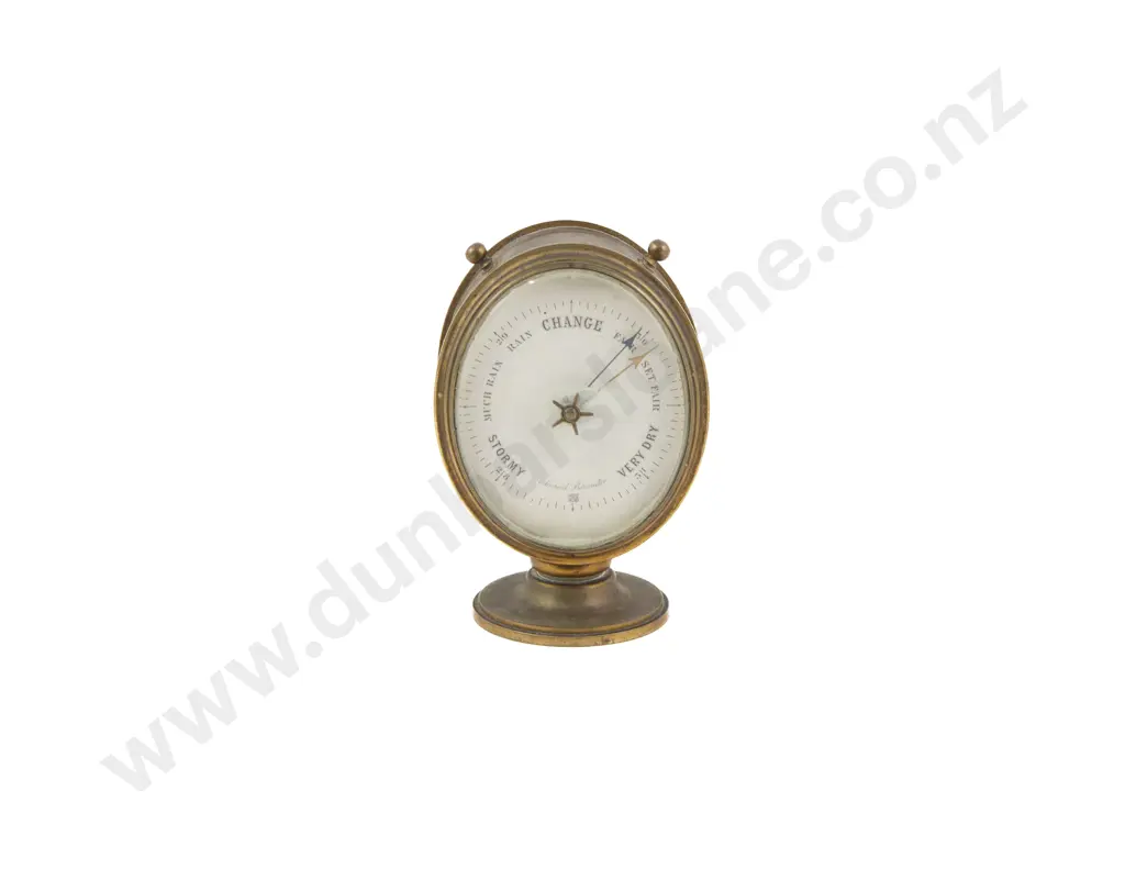 A Small Brass Cased Oval Aneroid Barometer Image 1++