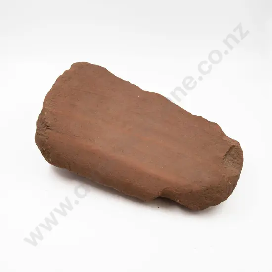 A Large Red Volcanic Polishing Stone From The Pitcairn Islands