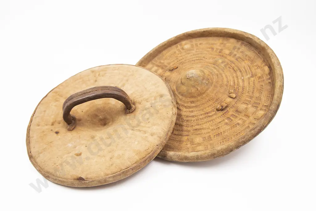 Two Embossed Hide Parrying Shields Image 1++