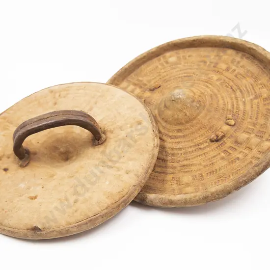 Two Embossed Hide Parrying Shields