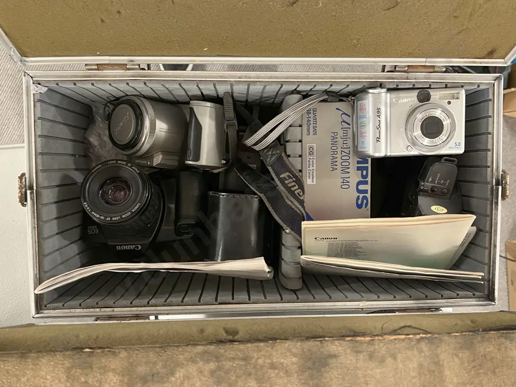 Pair of Canon EOS SLRs, One Canon Point & Shoot, One FujiFilm Telephoto Camcorder & Olympus Zoom 140 in Flight Case Image 1++