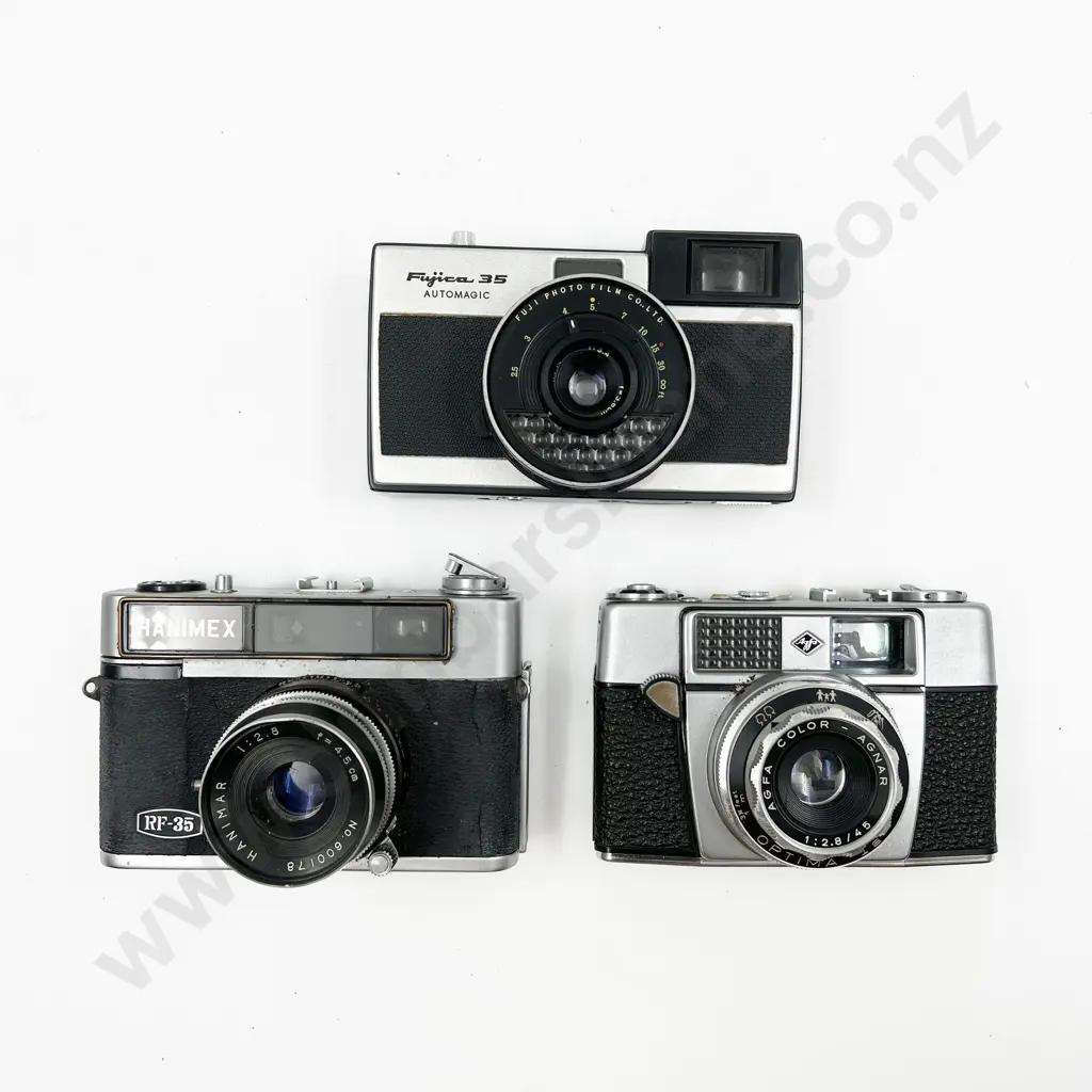 Three Rangefinder Film Cameras with Leather Cases Image 1++