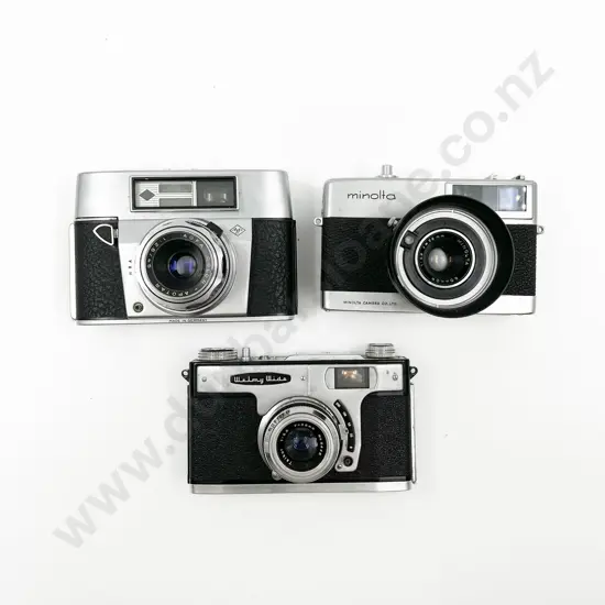 Three Cased Cameras