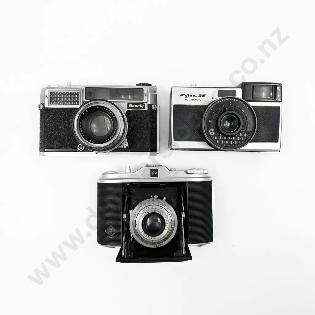 Three Cased Cameras with Two Light Meters Image 1++