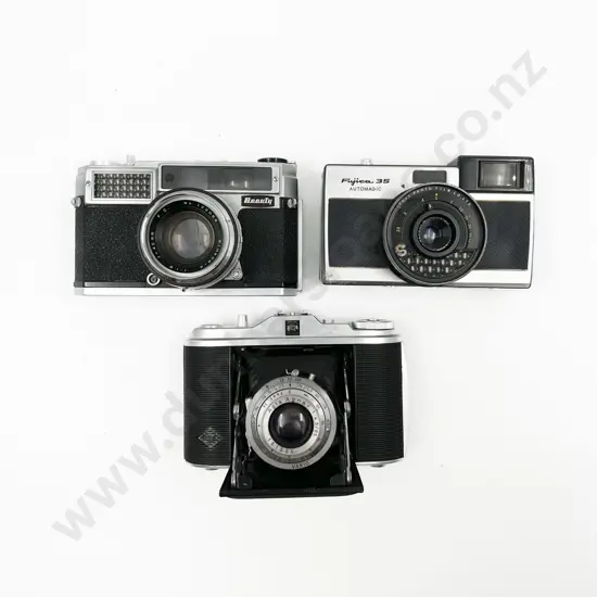 Three Cased Cameras with Two Light Meters