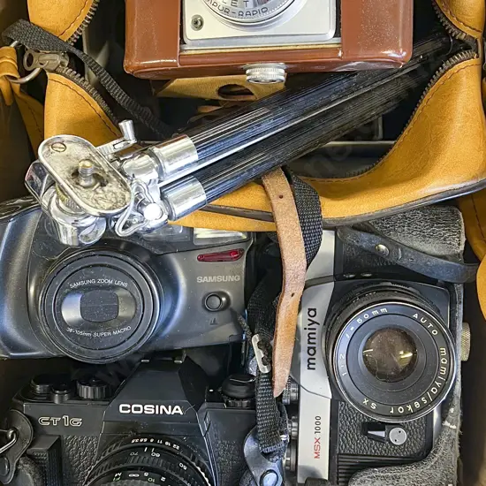 Four Assorted Cameras Including Accessories