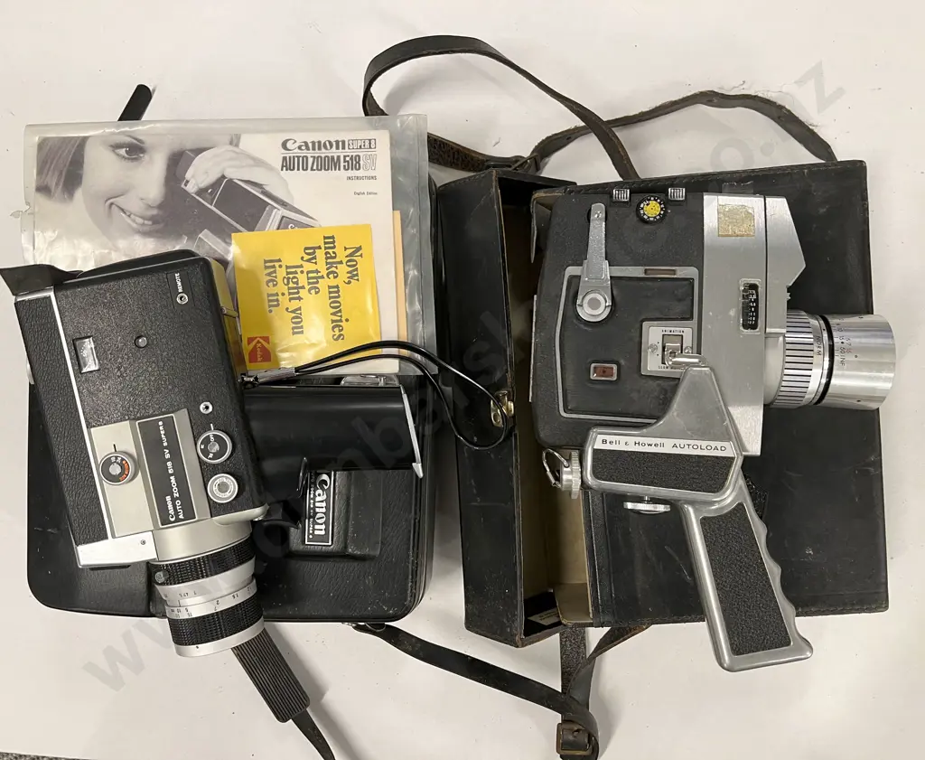 Two Cased Movie Cameras Image 1++