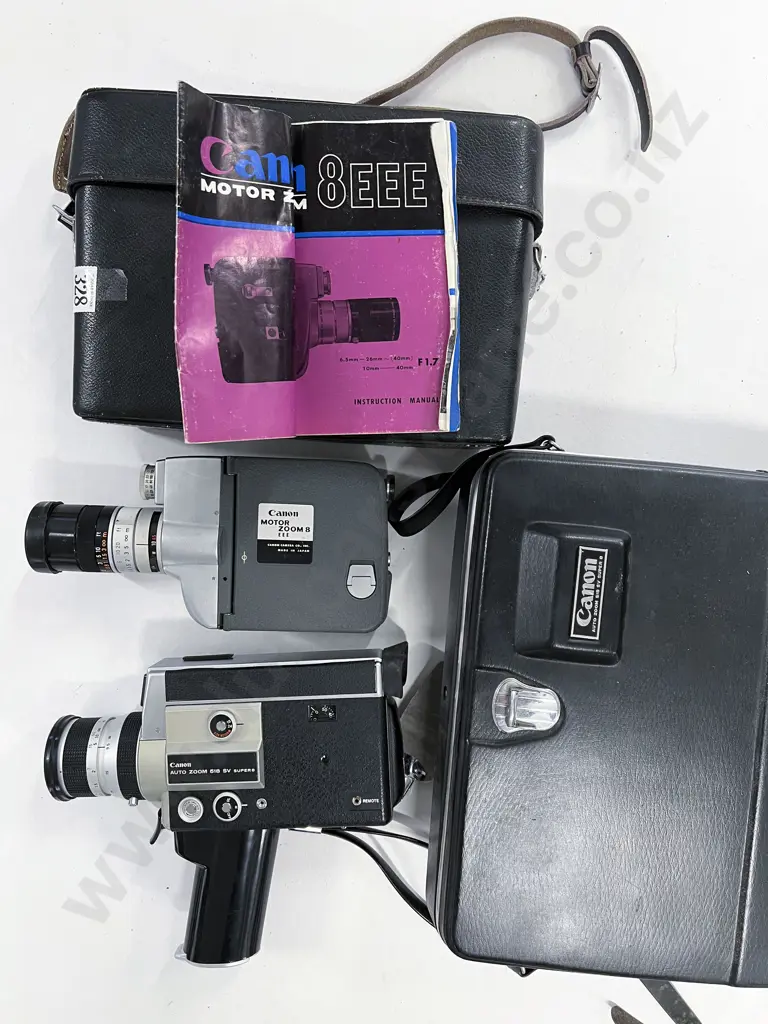 Two Cased Movie Cameras Image 1++