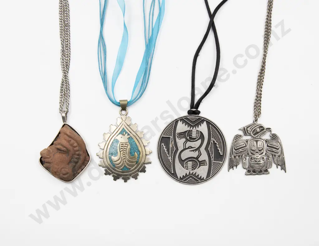 Four South American Silver and Metal Pendants Image 1++