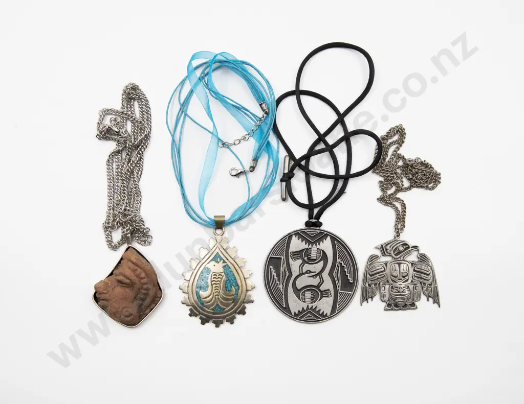 Four South American Silver and Metal Pendants Image 1++