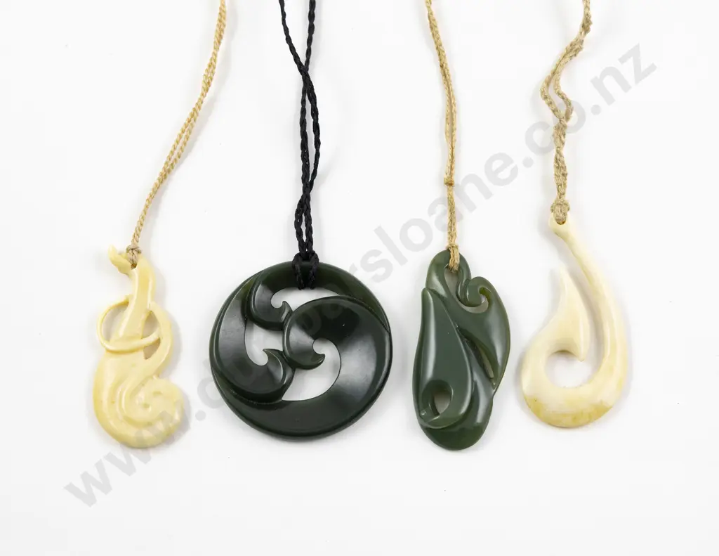 Maori Design Two Greenstone and Two Bone Pendants Image 1++