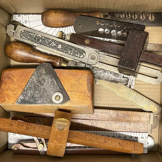 Box of Tools Including Folder Rulers