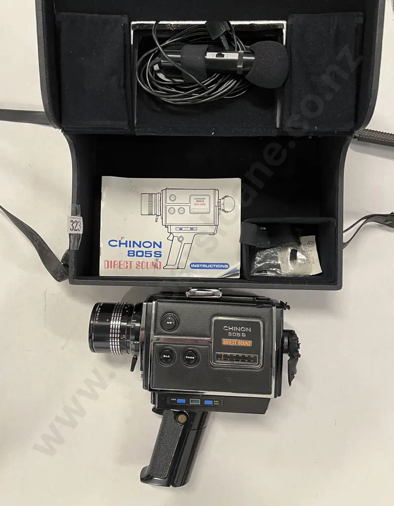 Two Hand-Held Movie Cameras Image 1++