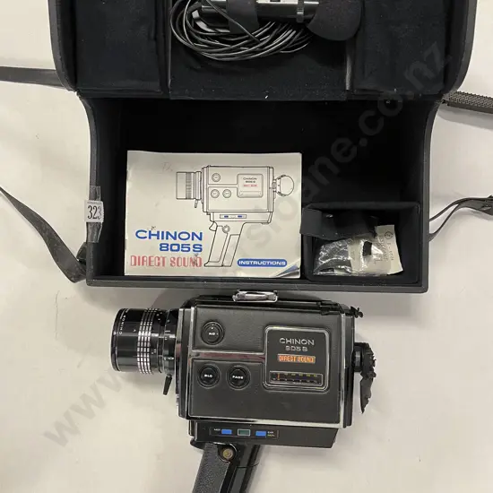 Two Hand-Held Movie Cameras