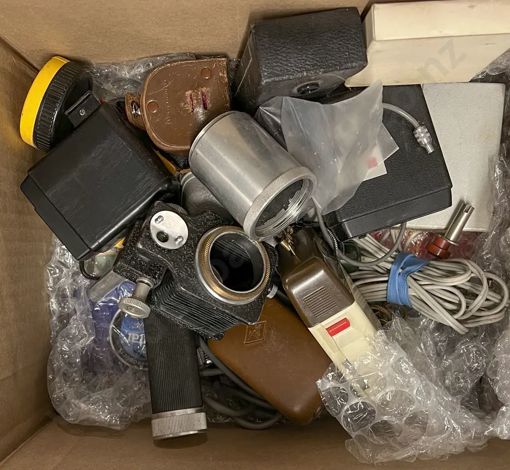 Two Lenses with Assorted Camera Accessories Image 1++