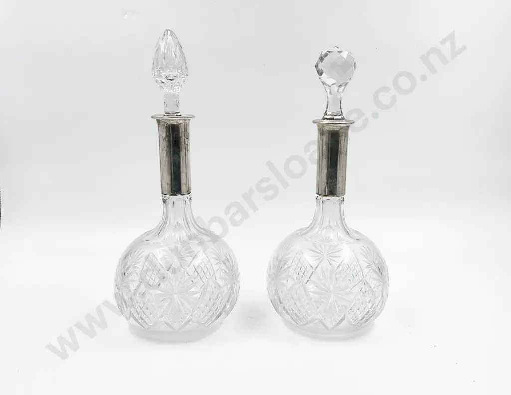 Pair Of Cut Crystal Decanters With .800 Silver Tops one stopper not matching Image 1++