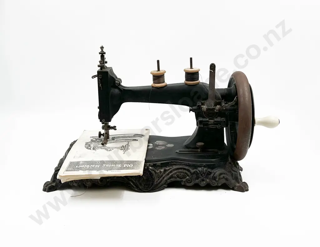 Vintage Sewing Machine on Wrought Metal Base Image 1++