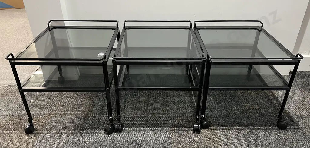 Three Modern Two Tier Glass Topped Trolleys Image 1++
