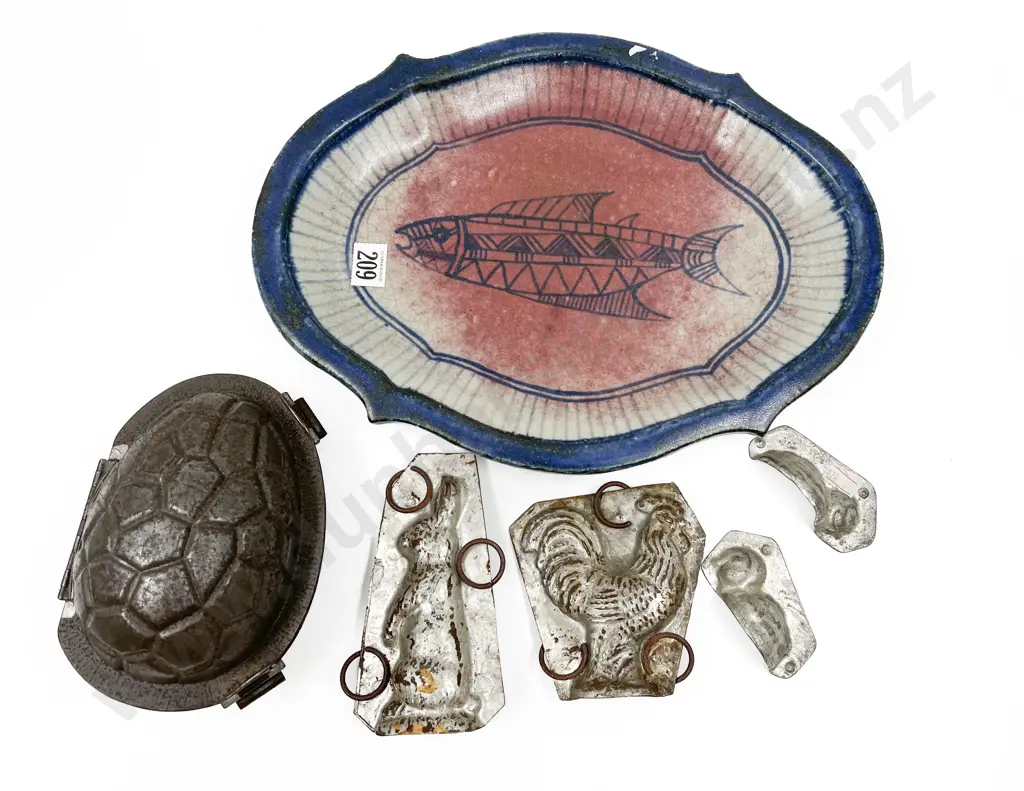 Four Assorted Vintage Chocolate Moulds on Pottery Plate Image 1++