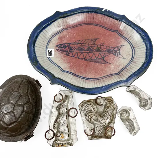 Four Assorted Vintage Chocolate Moulds on Pottery Plate