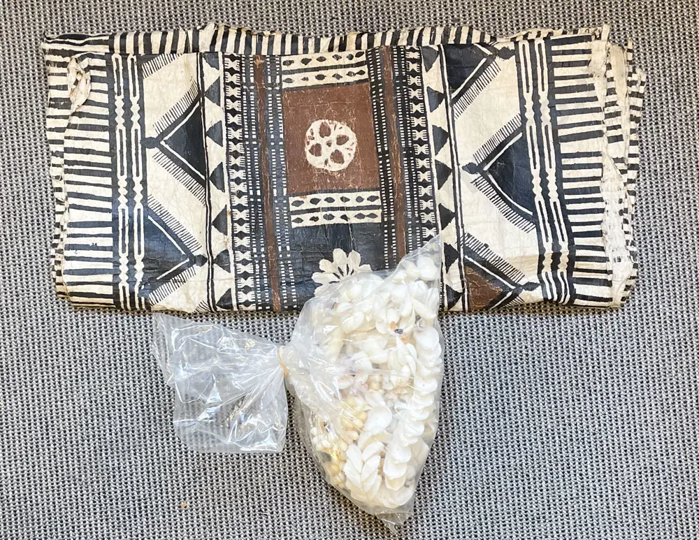 Bag of Assorted Shells Together with Tapa Cloth Image 1++