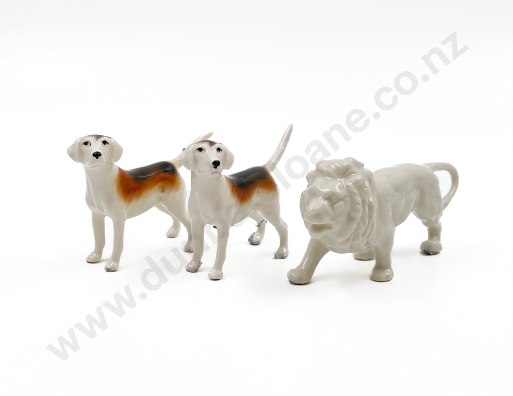 Small Lion Ornament Together with Pair of Beswick Dogs (one with repair to tail) Image 1++