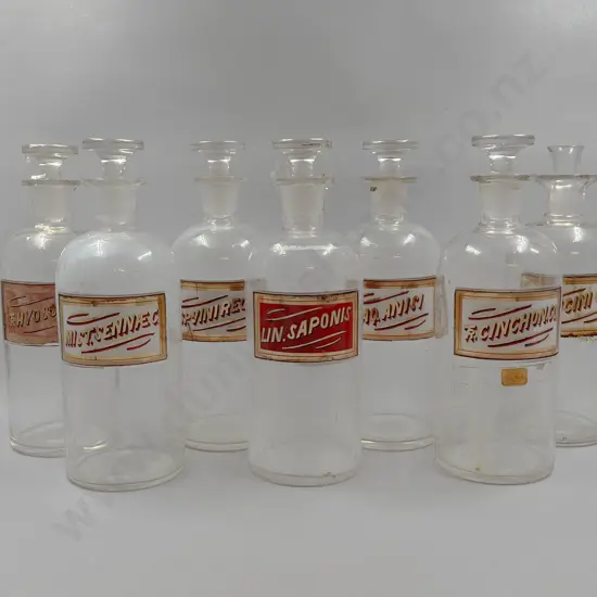 Seven Large Chemist Bottles