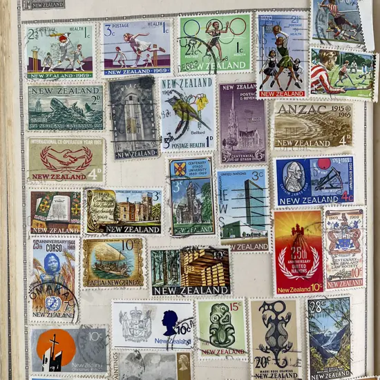 Two Small Vintage Stamp Albums World and NZ Stamps