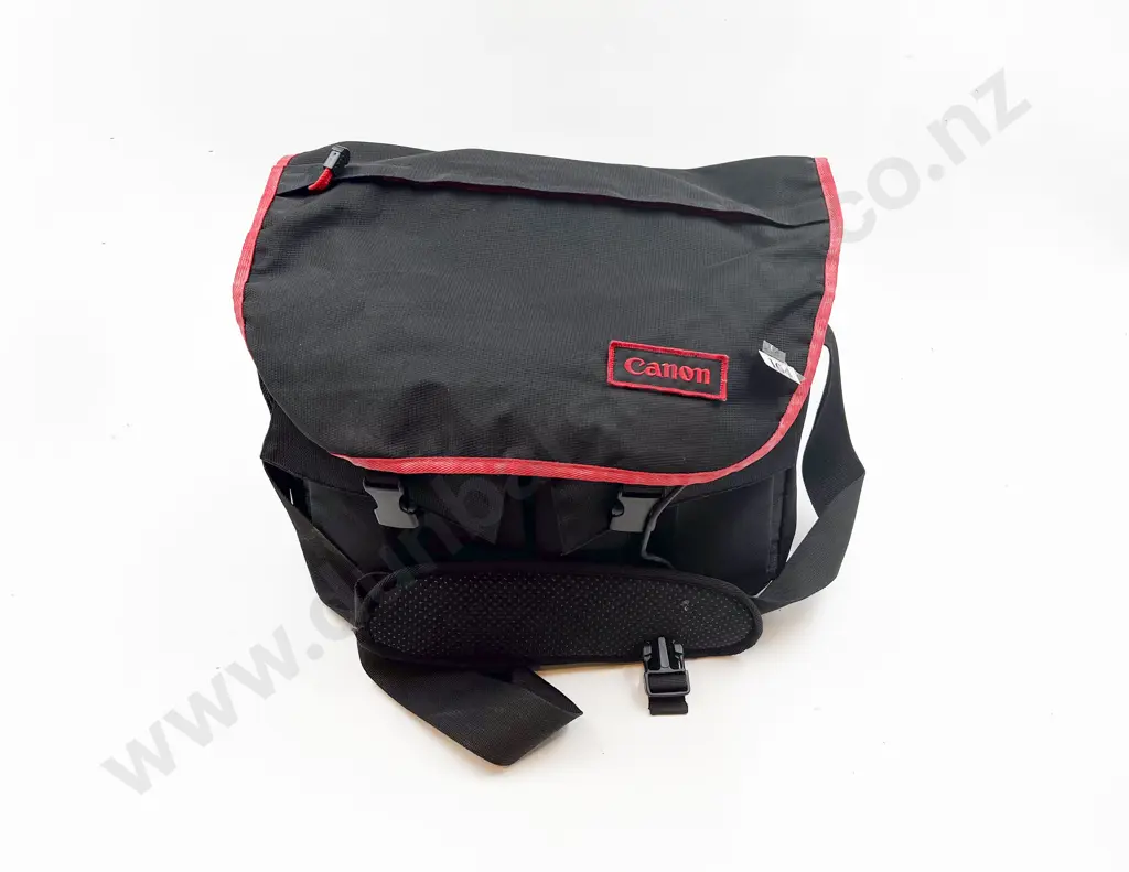 Two Cannon Cameras and Assorted Lenses in Carrying Bag Image 1++