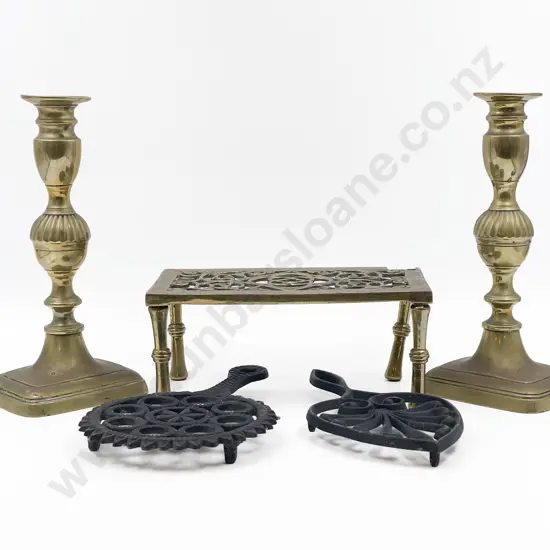 Pair of Brass Candlesticks and Three Assorted Trivets