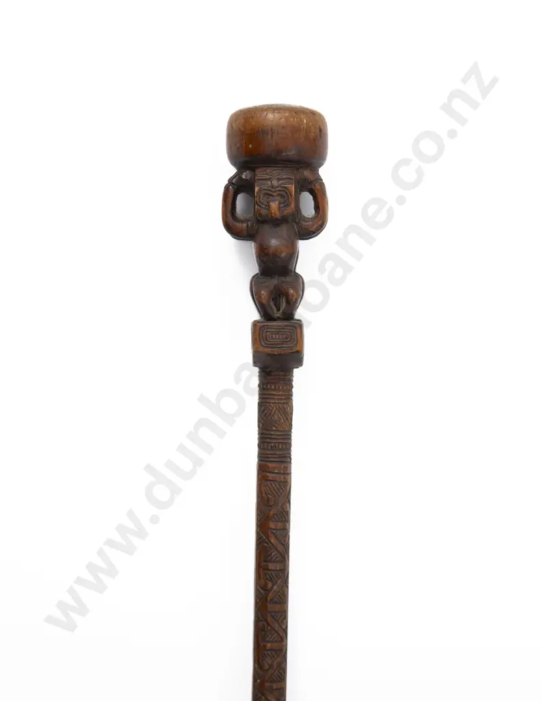A Late 19th Century Maori Carved Tokotoko/Orators Stick With Stylised FiguresThe handle with two stylised figures standing back-to-back below a compressed bun Image 1++