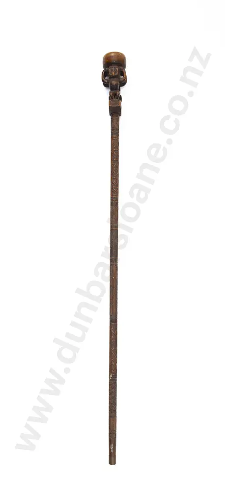 A Late 19th Century Maori Carved Tokotoko/Orators Stick With Stylised FiguresThe handle with two stylised figures standing back-to-back below a compressed bun Image 1++
