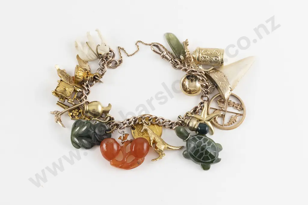 9ct Curb Link Charm Bracelet with various charms attached Image 1++