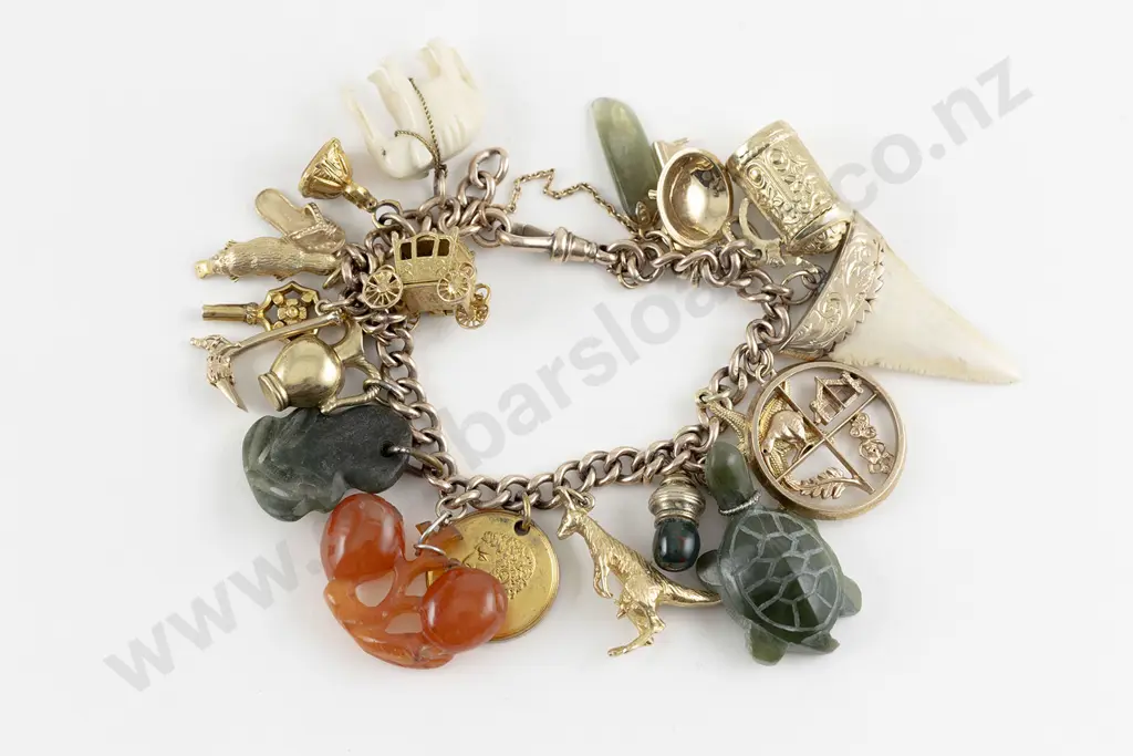 9ct Curb Link Charm Bracelet with various charms attached Image 1++