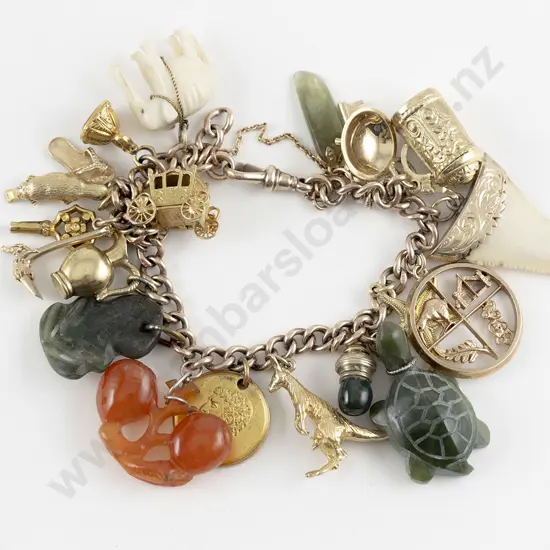 9ct Curb Link Charm Bracelet with various charms attached