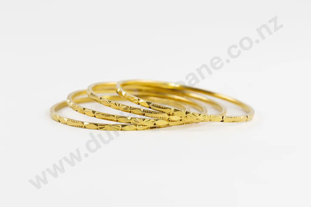 Four 24/22ct Bangles Image 1++