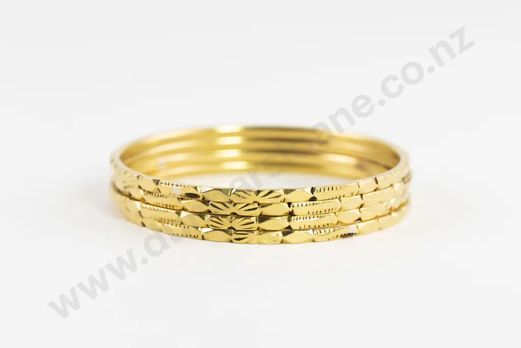 Four 24/22ct Bangles Image 1++