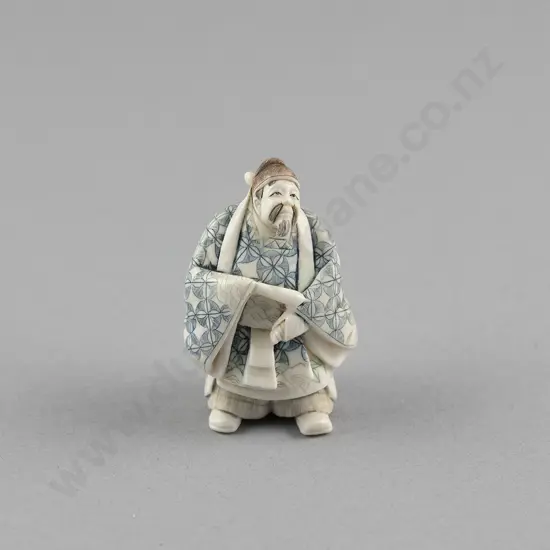 Signed and Stained Ivory Netsuke of a Standing Noble