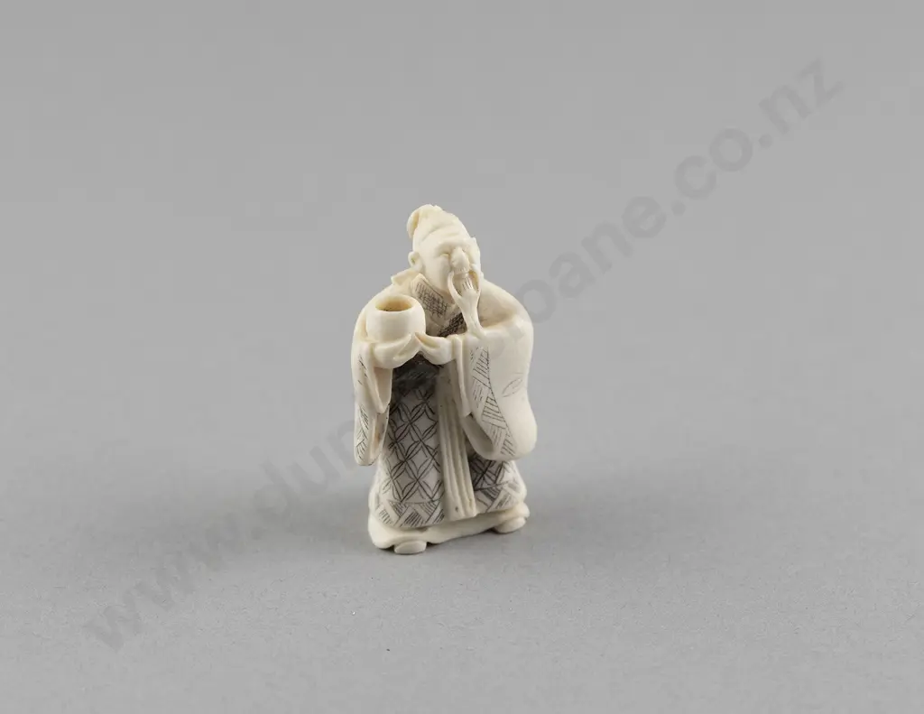 Signed Ivory Netsuke of a Standing Sage holding a Cup Image 1++