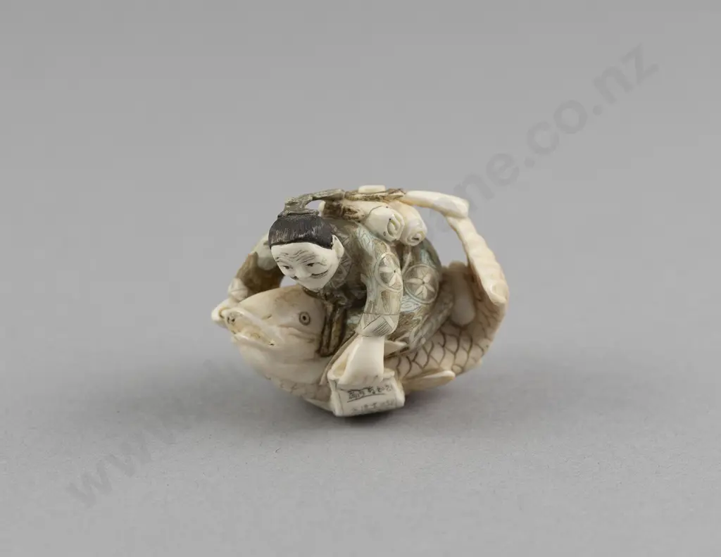 Signed and Stained Ivory Netsuke of an Immortal Kinko Riding a Giant Fish Image 1++
