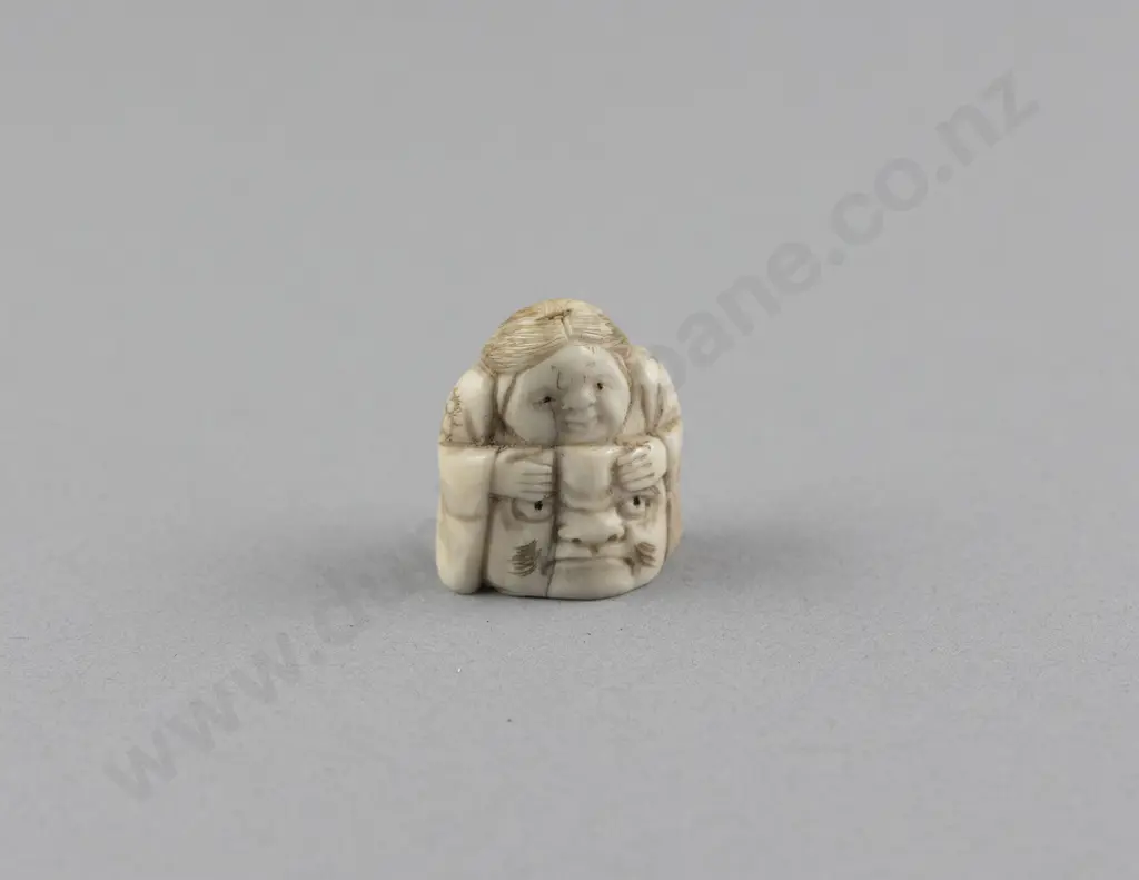 Ivory Netsuke of a Actor resting on his Mask Image 1++