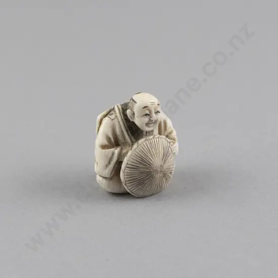 Signed Ivory Netsuke of a Samurai Straw Hat Maker