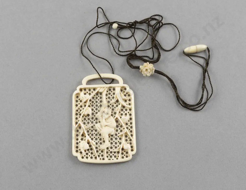 Carved Ivory Tablet Pendant with Monkey amongst Vines Image 1++