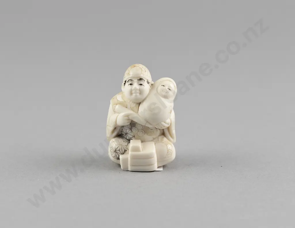 Signed Ivory Netsuke of a Doll Maker Image 1++