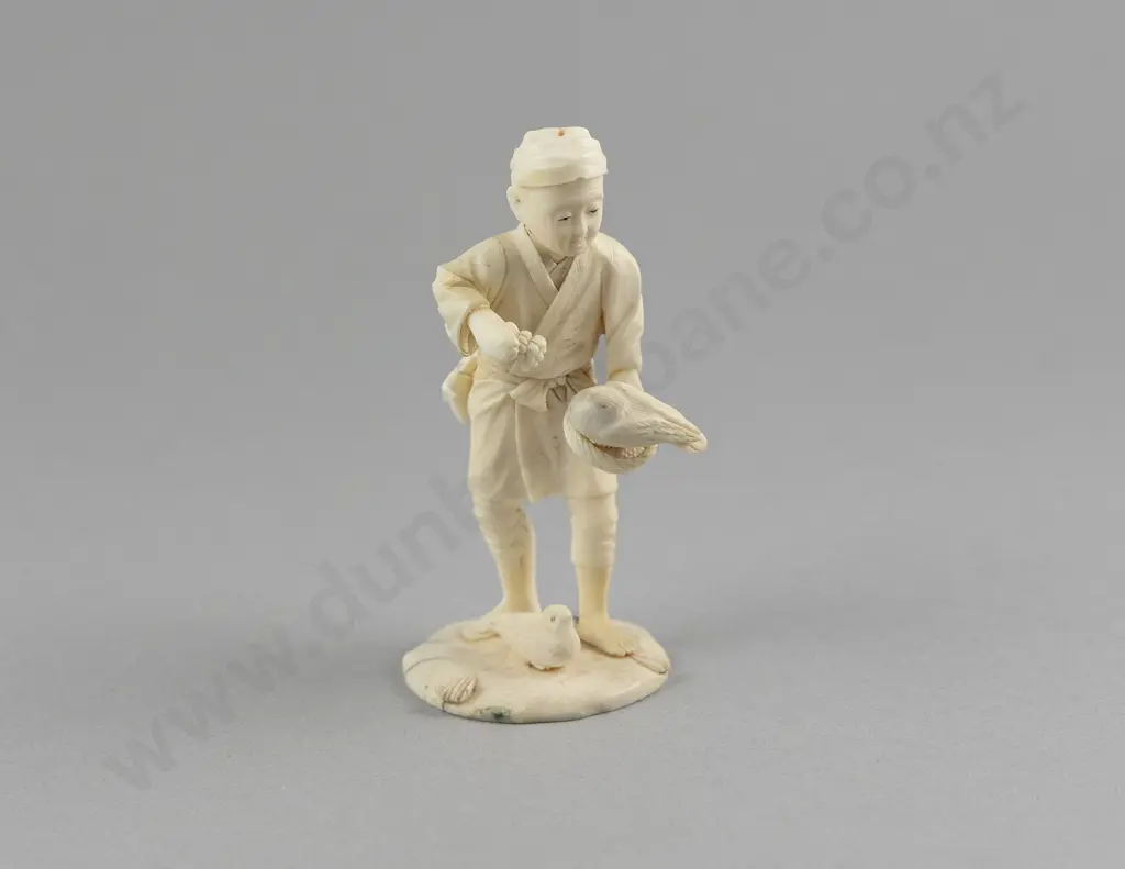 Signed Carved Ivory Figure of a Young Boy Feeding Birds Image 1++